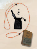 An orange SpecTether with a black mesh drawstring pouch, an attached black carabiner, and four black connector tips, displayed next to a brown cardboard SpecTether-branded box.